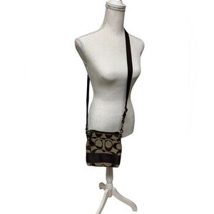 Ladies coach Crossbody. Brown and tan and color.
